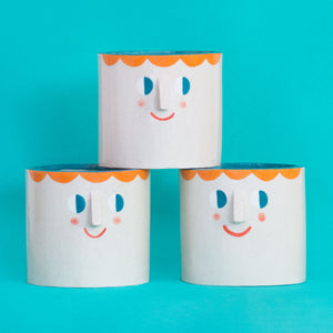 Friendly Faces with Orange Hair/ Ceramic Pot